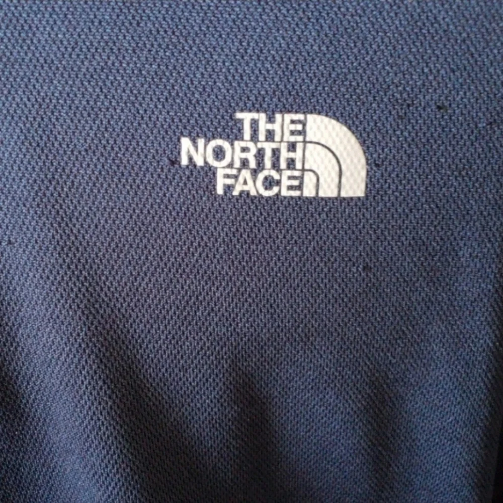 The North Face 1/4 zip navy blue pullover